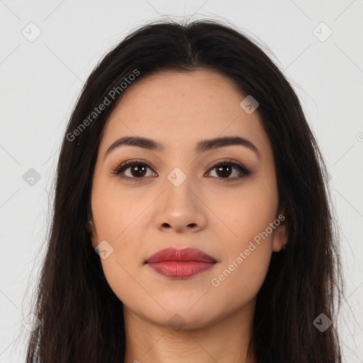 Joyful latino young-adult female with long  brown hair and brown eyes