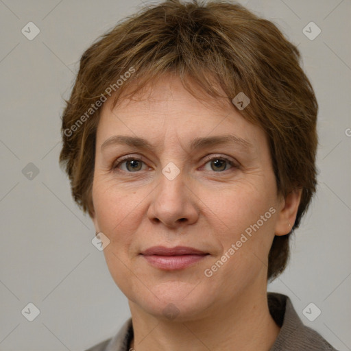 Joyful white adult female with medium  brown hair and grey eyes