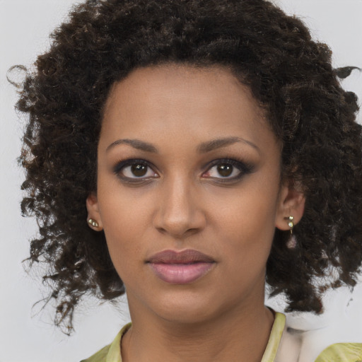 Neutral black young-adult female with medium  brown hair and brown eyes