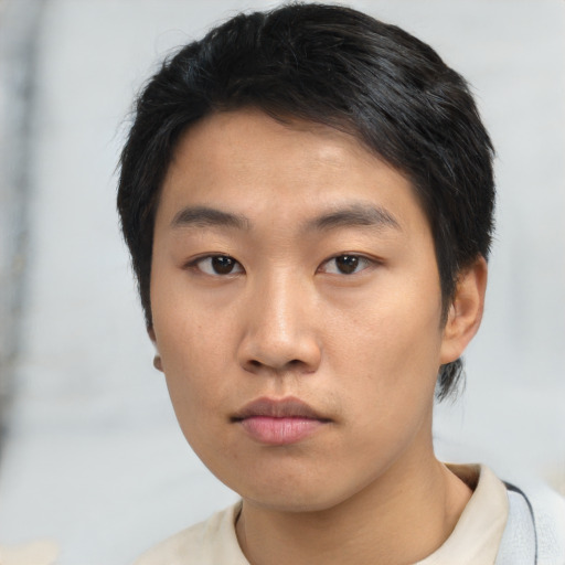 Neutral asian young-adult male with short  black hair and brown eyes