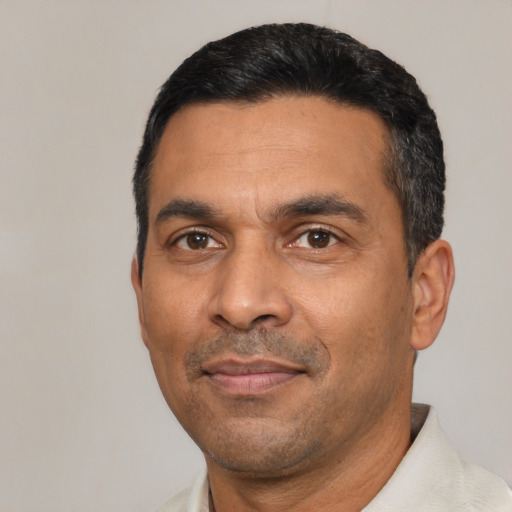 Neutral latino adult male with short  black hair and brown eyes