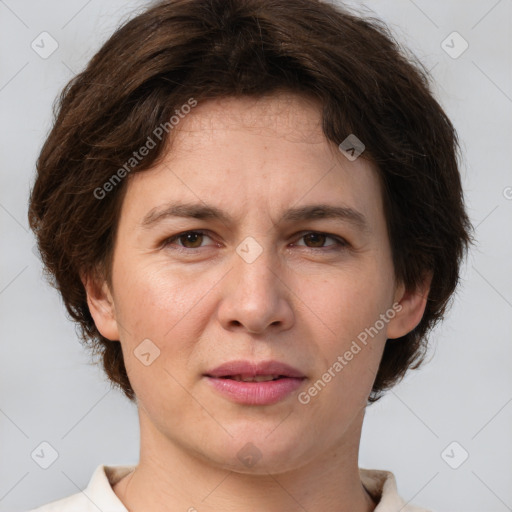 Joyful white adult female with short  brown hair and brown eyes