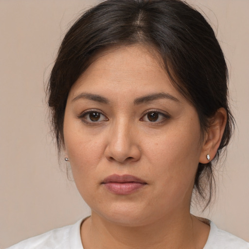 Joyful white young-adult female with medium  brown hair and brown eyes