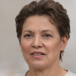 Joyful white adult female with short  brown hair and brown eyes