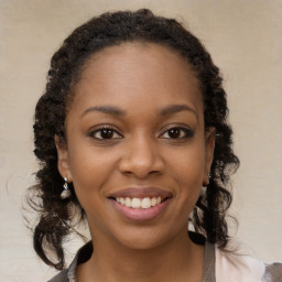 Joyful black young-adult female with medium  brown hair and brown eyes