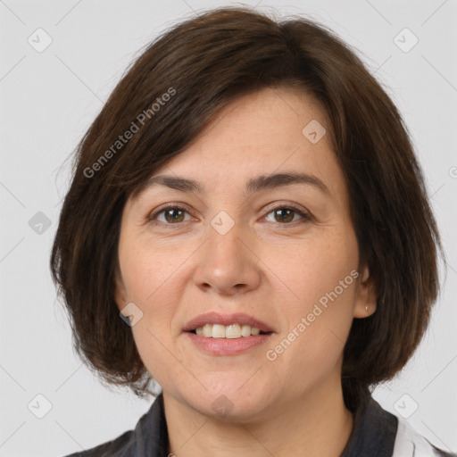 Joyful white adult female with medium  brown hair and brown eyes