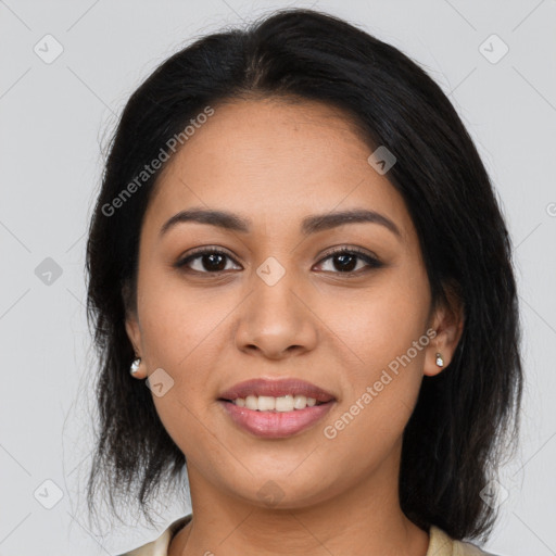 Joyful latino young-adult female with medium  brown hair and brown eyes