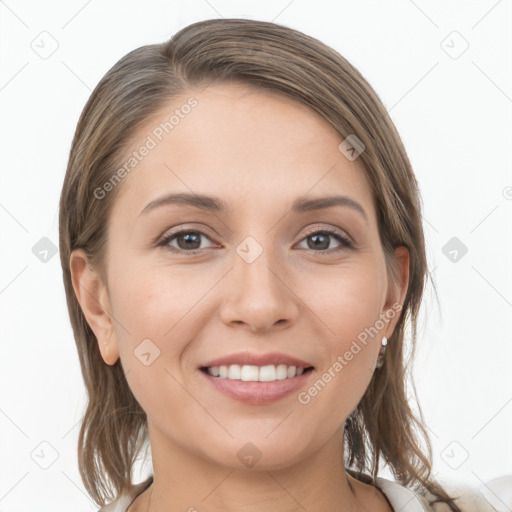 Joyful white young-adult female with medium  brown hair and grey eyes