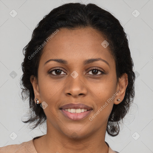 Joyful black young-adult female with medium  brown hair and brown eyes