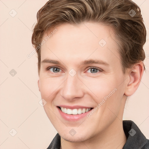 Joyful white young-adult female with short  brown hair and grey eyes