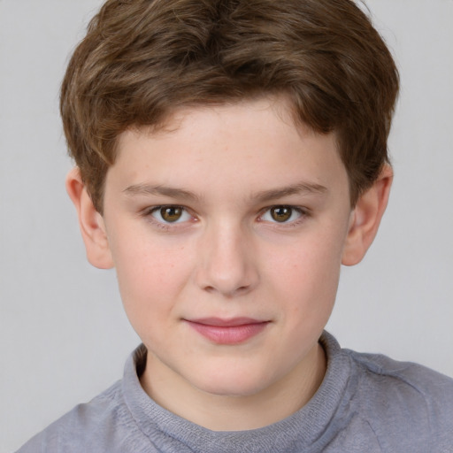 Joyful white child male with short  brown hair and grey eyes