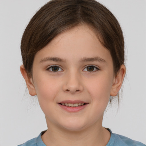 Joyful white child female with short  brown hair and brown eyes