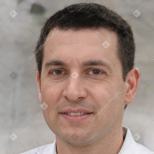 Joyful white adult male with short  brown hair and brown eyes