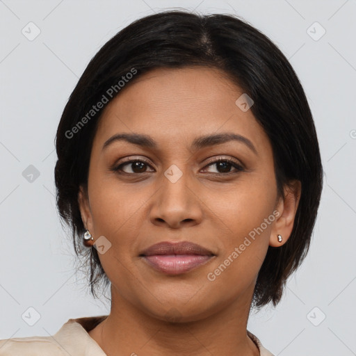 Joyful latino adult female with medium  brown hair and brown eyes