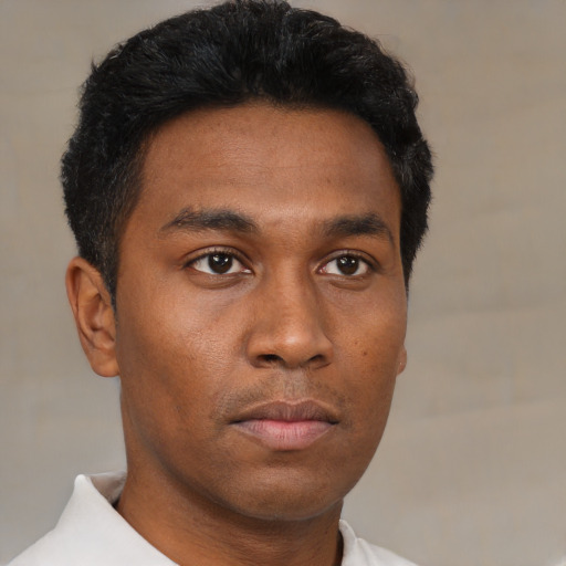 Neutral black young-adult male with short  black hair and brown eyes