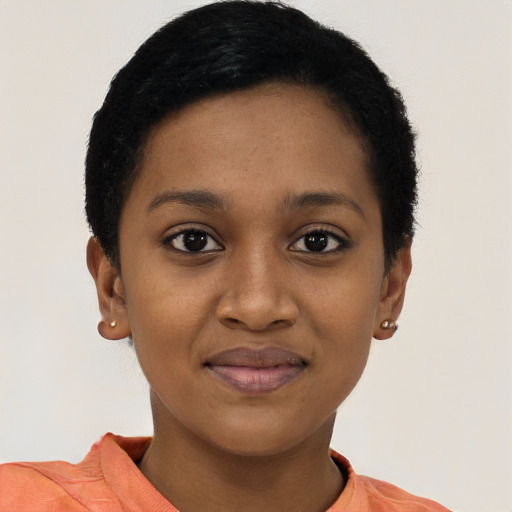 Joyful black young-adult female with short  black hair and brown eyes