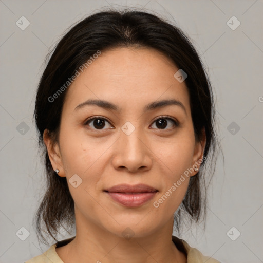 Joyful latino young-adult female with medium  brown hair and brown eyes