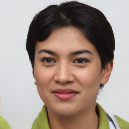 Joyful asian young-adult female with short  black hair and brown eyes