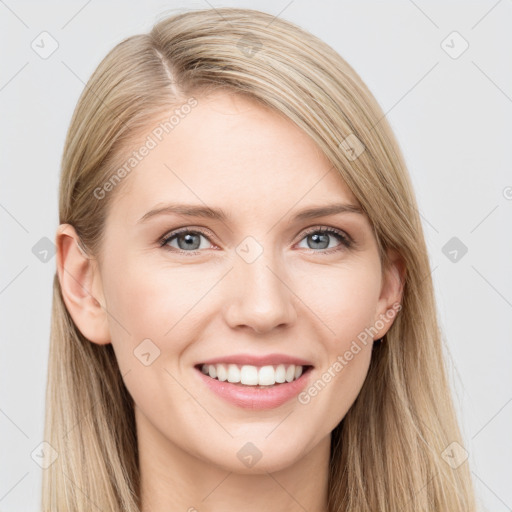 Joyful white young-adult female with long  brown hair and blue eyes