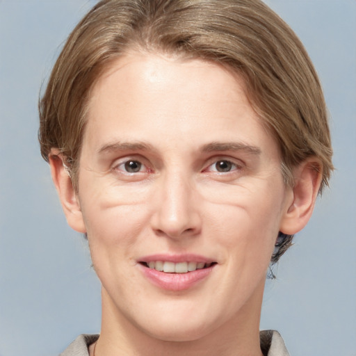 Joyful white adult female with medium  brown hair and grey eyes