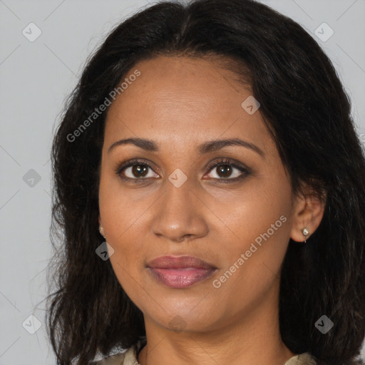 Joyful black adult female with medium  brown hair and brown eyes