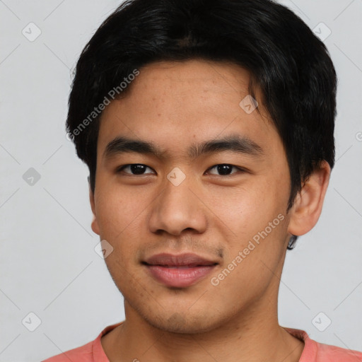 Joyful asian young-adult male with short  brown hair and brown eyes