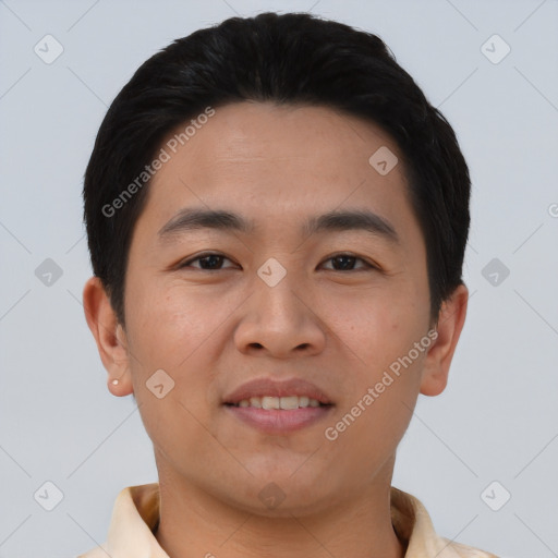 Joyful asian young-adult male with short  black hair and brown eyes