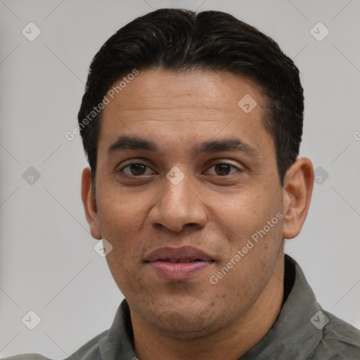 Joyful white adult male with short  black hair and brown eyes