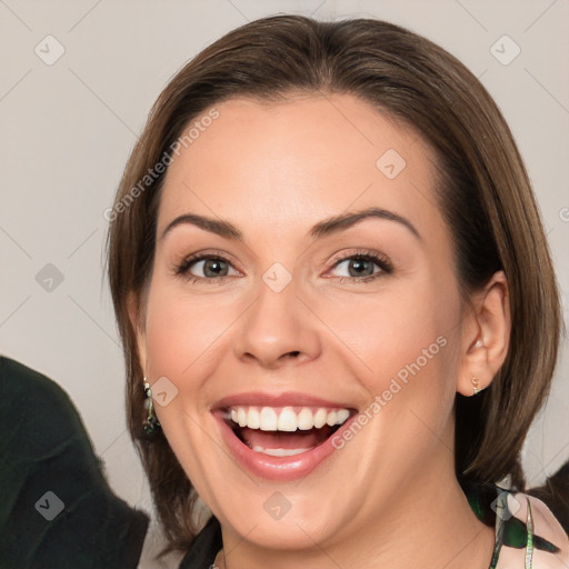 Joyful white young-adult female with medium  brown hair and green eyes