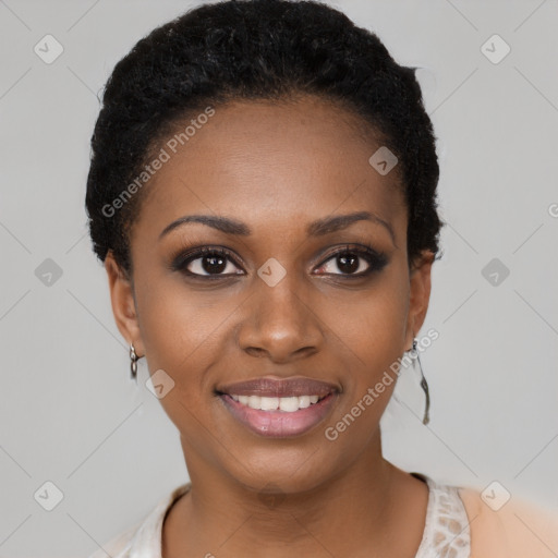 Joyful black young-adult female with short  black hair and brown eyes