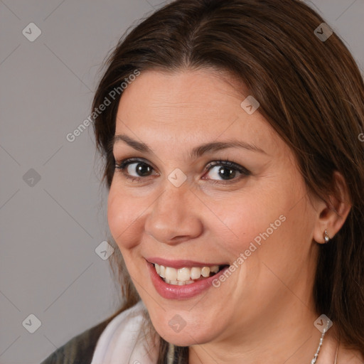 Joyful white adult female with medium  brown hair and brown eyes