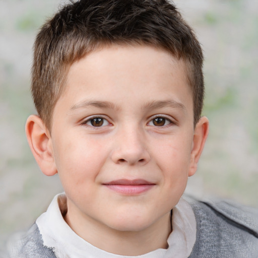 Joyful white child male with short  brown hair and brown eyes