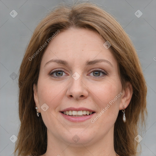 Joyful white adult female with medium  brown hair and grey eyes