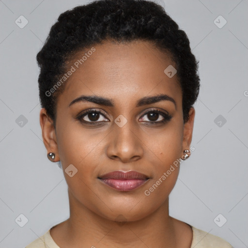 Joyful black young-adult female with short  black hair and brown eyes