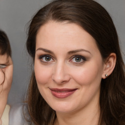 Joyful white young-adult female with medium  brown hair and brown eyes