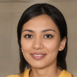 Joyful latino young-adult female with medium  black hair and brown eyes