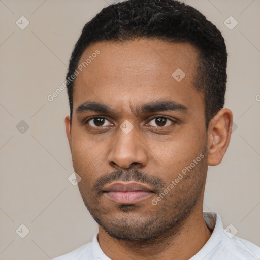 Neutral latino young-adult male with short  black hair and brown eyes