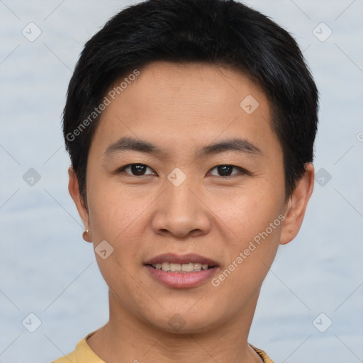 Joyful asian young-adult male with short  brown hair and brown eyes