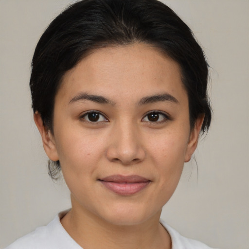 Joyful asian young-adult female with medium  brown hair and brown eyes