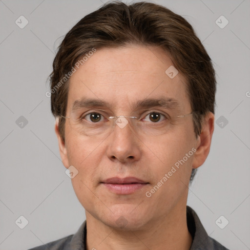 Joyful white adult male with short  brown hair and grey eyes