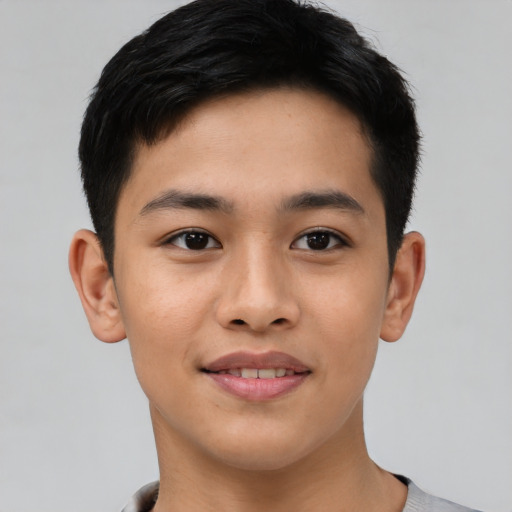 Joyful asian young-adult male with short  brown hair and brown eyes