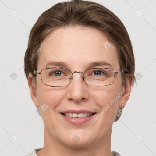 Joyful white adult female with short  brown hair and grey eyes