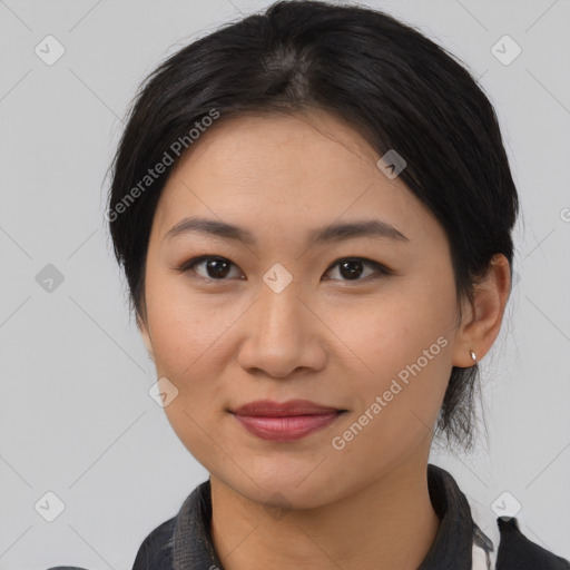 Joyful asian young-adult female with medium  brown hair and brown eyes