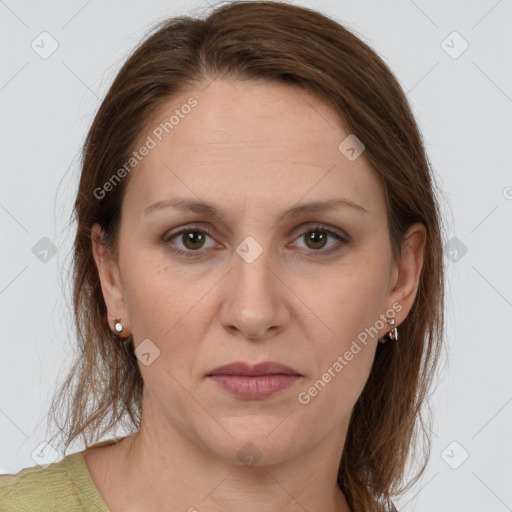 Joyful white adult female with long  brown hair and grey eyes