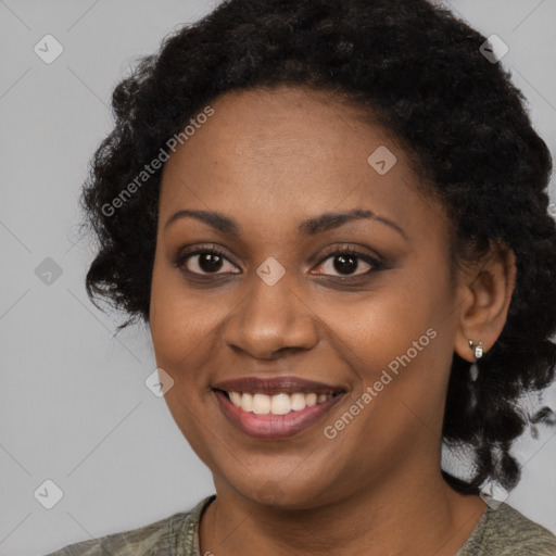 Joyful black young-adult female with medium  black hair and brown eyes