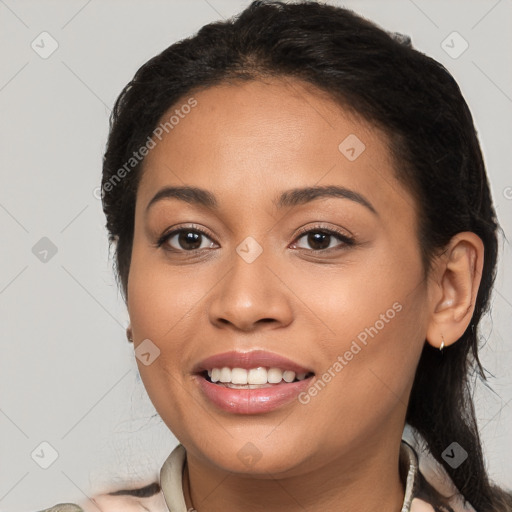 Joyful latino young-adult female with medium  brown hair and brown eyes