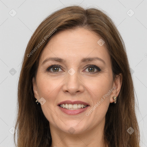 Joyful white adult female with long  brown hair and grey eyes