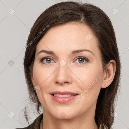 Joyful white young-adult female with medium  brown hair and grey eyes