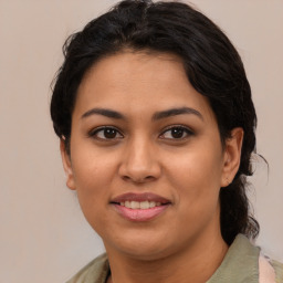 Joyful asian young-adult female with medium  brown hair and brown eyes