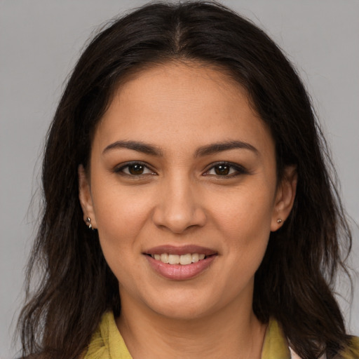 Joyful white young-adult female with long  brown hair and brown eyes